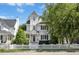Charming two-story home featuring a beautiful white picket fence and well-manicured landscaping at 111 Chancellors Ridge Dr, Durham, NC 27713