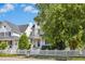 Charming two-story home featuring a beautiful white picket fence and well-manicured landscaping at 111 Chancellors Ridge Dr, Durham, NC 27713