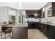 This modern kitchen features a center island with bar stools and an open layout, ideal for entertaining and meal preparation at 111 Chancellors Ridge Dr, Durham, NC 27713