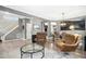 Inviting living room featuring a fireplace, hardwood floors, and open view to the dining area at 111 Chancellors Ridge Dr, Durham, NC 27713