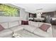 The living room connects to the kitchen and features a spacious sectional, a modern coffee table, and colorful decor at 111 Chancellors Ridge Dr, Durham, NC 27713