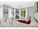 Cozy living room featuring large windows, plush seating, a ceiling fan, and a neutral color palette for relaxation at 111 Chancellors Ridge Dr, Durham, NC 27713