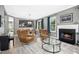 Inviting living room featuring a fireplace, hardwood floors, and open view to the dining area at 111 Chancellors Ridge Dr, Durham, NC 27713