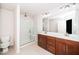 This bathroom showcases a tiled shower, double vanity, and modern fixtures at 114 Constitution Dr, Durham, NC 27705