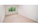 Bedroom with large window looking out to a leafy view at 114 Constitution Dr, Durham, NC 27705