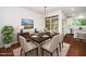 Dining area with hardwood floors featuring a dining table and a modern lighting fixture at 114 Constitution Dr, Durham, NC 27705