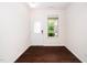 Bright foyer features beautiful hardwood floors, a large window, and a front door at 114 Constitution Dr, Durham, NC 27705