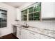 Close-up view of kitchen counter featuring granite countertops, subway tile backsplash, and modern fixtures at 114 Constitution Dr, Durham, NC 27705