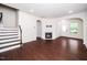 Spacious living area features a fireplace, hardwood floors, and arched doorways at 114 Constitution Dr, Durham, NC 27705