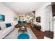 Comfortable and staged living room area with hardwood floors and ample natural light at 114 Constitution Dr, Durham, NC 27705
