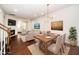 Open floor plan showing dining and living area with hardwood floors and neutral decor at 114 Constitution Dr, Durham, NC 27705
