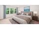 Staged main bedroom with serene view, plush bedding, and stylish decor at 114 Constitution Dr, Durham, NC 27705