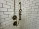 Close-up of shower with white subway tiles and modern fixtures at 114 Constitution Dr, Durham, NC 27705