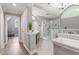 Beautiful bathroom featuring dual sinks, walk-in shower and soaker tub at 117 Arborhill Ln, Holly Springs, NC 27540