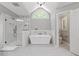 Stunning bathroom featuring a glass shower and freestanding tub, creating a spa-like experience at 117 Arborhill Ln, Holly Springs, NC 27540