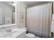 Bathroom featuring a vanity with chrome fixtures and shower with curtain at 117 Arborhill Ln, Holly Springs, NC 27540
