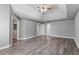 Expansive bedroom features hardwood floors and stylish decor with two entryways at 117 Arborhill Ln, Holly Springs, NC 27540