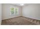 Bedroom featuring a window with tree top views at 117 Arborhill Ln, Holly Springs, NC 27540