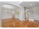 Spacious dining room showcases gleaming hardwood floors, decorative molding, and abundant natural light from the windows at 117 Arborhill Ln, Holly Springs, NC 27540
