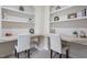 Bright office space with built-in shelves, offering ample storage and organization at 117 Arborhill Ln, Holly Springs, NC 27540