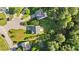 Aerial view of neighborhood showcasing a home with a large backyard and surrounding trees at 118 Brandi Dr, Rolesville, NC 27571