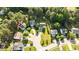 A peaceful neighborhood with mature trees surrounding well-maintained homes on a sunny day at 118 Brandi Dr, Rolesville, NC 27571