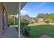Spacious backyard with lush green lawn, mature trees, and a view of neighboring houses at 118 Brandi Dr, Rolesville, NC 27571