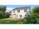 Back exterior of a two-story home with a patio and large backyard, surrounded by greenery at 118 Brandi Dr, Rolesville, NC 27571