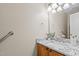 Bathroom featuring granite countertop, wood cabinets, and modern fixtures for a clean, updated look at 118 Brandi Dr, Rolesville, NC 27571