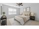 Bright bedroom featuring a neutral color palette, plush bedding, and a ceiling fan at 118 Brandi Dr, Rolesville, NC 27571