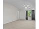 Bright bedroom with plush carpeting, ceiling fan, and large window offering natural light at 118 Brandi Dr, Rolesville, NC 27571