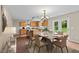 Inviting dining area adjacent to kitchen features modern table and backyard access at 118 Brandi Dr, Rolesville, NC 27571