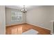 Empty room with hardwood floors, a large window, neutral walls ready to be customized for any use at 118 Brandi Dr, Rolesville, NC 27571