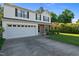 Exterior of two-story home featuring a two-car garage and well-maintained lawn at 118 Brandi Dr, Rolesville, NC 27571