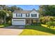Charming two-story home features a well-maintained lawn, brick accents, and an attached two-car garage at 118 Brandi Dr, Rolesville, NC 27571