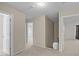 Upstairs hallway between rooms is brightly lit with neutral carpet at 118 Brandi Dr, Rolesville, NC 27571