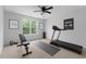 A well-equipped home gym with a treadmill, weight bench, and exercise equipment at 118 Brandi Dr, Rolesville, NC 27571