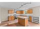 Bright kitchen features stainless steel appliances, granite countertops, and eat-in island at 118 Brandi Dr, Rolesville, NC 27571