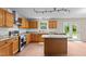 Updated kitchen featuring stainless appliances, granite countertops and tile backsplash at 118 Brandi Dr, Rolesville, NC 27571