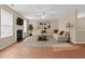 Spacious living room featuring a cozy fireplace, plush seating, and a ceiling fan for added comfort at 118 Brandi Dr, Rolesville, NC 27571