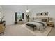 Spacious main bedroom with a ceiling fan, sitting area, and natural light, creating a relaxing retreat at 118 Brandi Dr, Rolesville, NC 27571