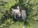 Overhead aerial view of home with driveway and lush trees surrounding it at 1211 New Grissom Way, Wake Forest, NC 27587