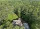 Aerial view of the property surrounded by lush greenery and mature trees at 1211 New Grissom Way, Wake Forest, NC 27587