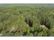 Aerial view of home featuring mature trees and lush landscaping at 1211 New Grissom Way, Wake Forest, NC 27587