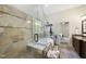 Bright bathroom featuring a glass enclosed shower and soaking tub next to vanity at 1211 New Grissom Way, Wake Forest, NC 27587
