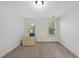 Bright bedroom featuring neutral carpeting, a window, and overhead lighting at 1211 New Grissom Way, Wake Forest, NC 27587