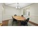 Well-lit dining room with a classic wood table and stylish chairs at 1211 New Grissom Way, Wake Forest, NC 27587
