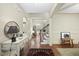 Bright foyer with hardwood floors, staircase, and decorative table at 1211 New Grissom Way, Wake Forest, NC 27587