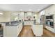 A kitchen with granite countertops, stainless steel appliances, and center island at 1211 New Grissom Way, Wake Forest, NC 27587