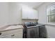 Well-lit laundry room featuring a sink and modern washer and dryer at 1211 New Grissom Way, Wake Forest, NC 27587
